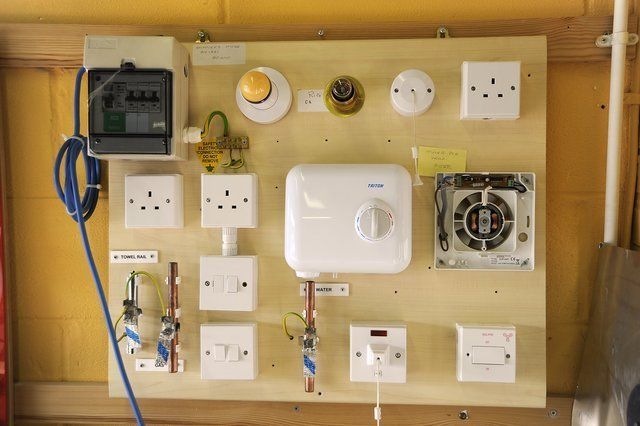 A wall with a bunch of electrical equipment on it